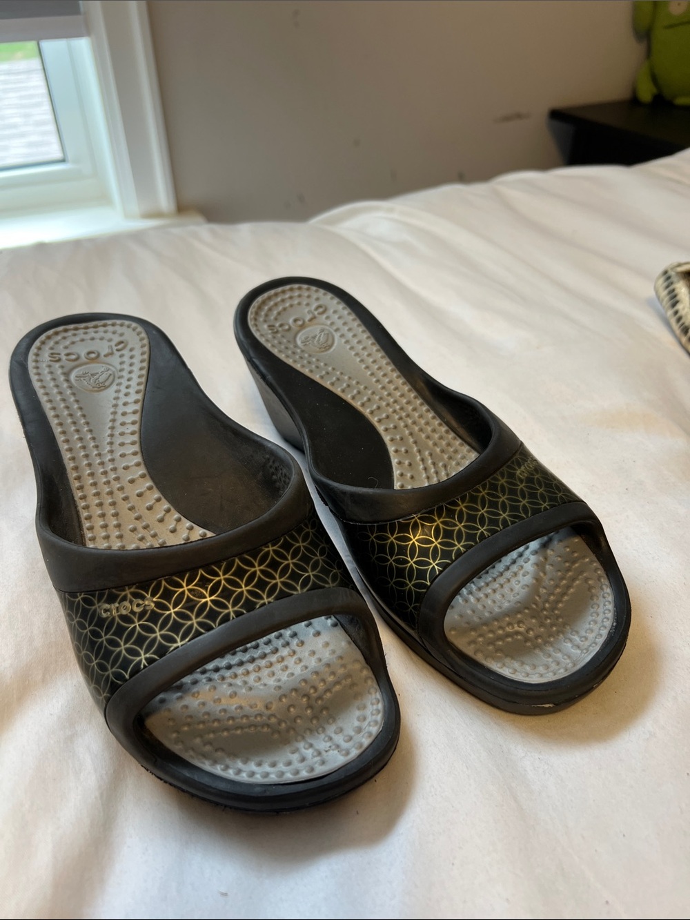 CROCS Black Slide Sandals with Gold Geometric Accent